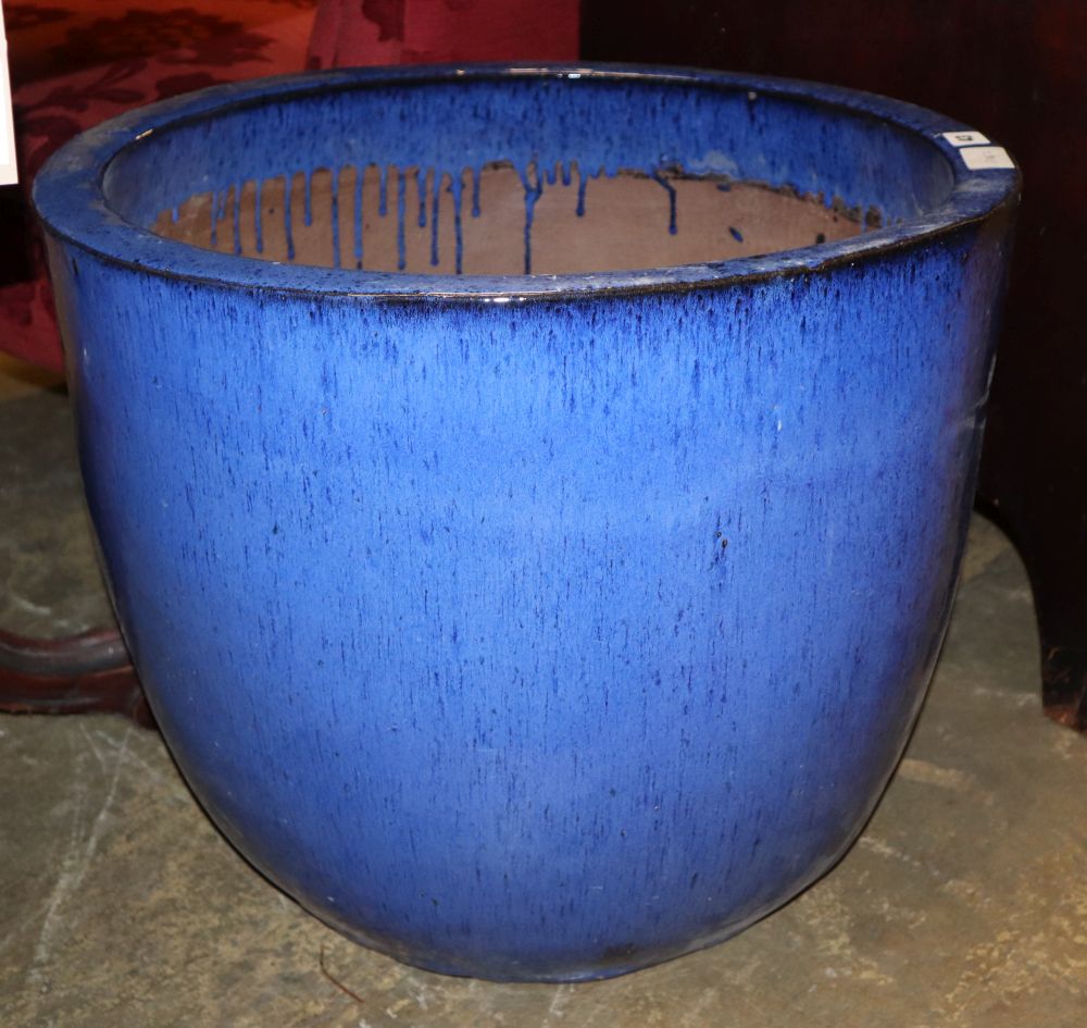 A large blue glazed garden planter, 55cm diameter, H.46cm
